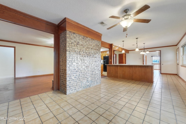 43 Greenbriar Dr, Gulfport, MS 39507 - kitchen with visible vents, crown molding, ceiling fan, black fridge, and light tile patterned floors