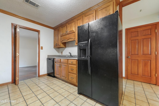 43 Greenbriar Dr, Gulfport, MS 39507 - kitchen featuring light tile patterned flooring, a sink, visible vents, black appliances, and brown cabinets