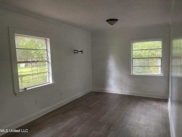 2938 Oak Forest Dr, Jackson, MS 39212 - spare room with ornamental molding and dark wood-style flooring