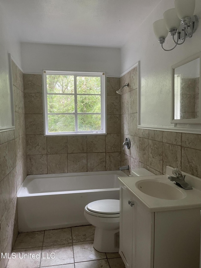 2938 Oak Forest Dr, Jackson, MS 39212 - full bathroom featuring vanity, tub / shower combination, tile walls, tile patterned flooring, and a chandelier