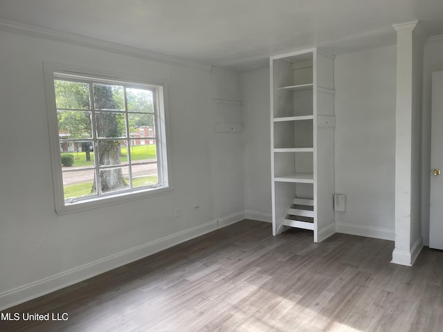 2938 Oak Forest Dr, Jackson, MS 39212 - unfurnished bedroom with wood finished floors and ornamental molding