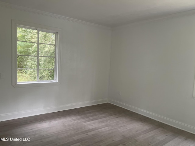 2938 Oak Forest Dr, Jackson, MS 39212 - unfurnished room with dark wood-style floors and crown molding