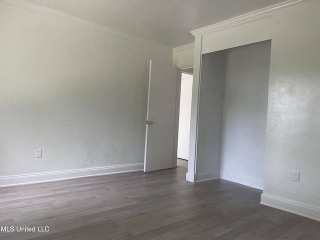 2938 Oak Forest Dr, Jackson, MS 39212 - empty room featuring dark wood-style flooring and ornamental molding