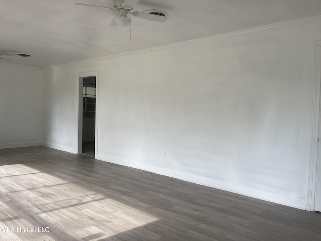 2938 Oak Forest Dr, Jackson, MS 39212 - empty room with a ceiling fan, dark wood-type flooring, and crown molding