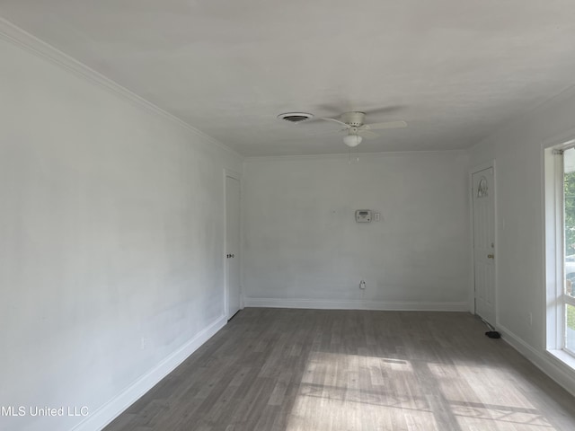 2938 Oak Forest Dr, Jackson, MS 39212 - spare room featuring plenty of natural light, a ceiling fan, and wood finished floors