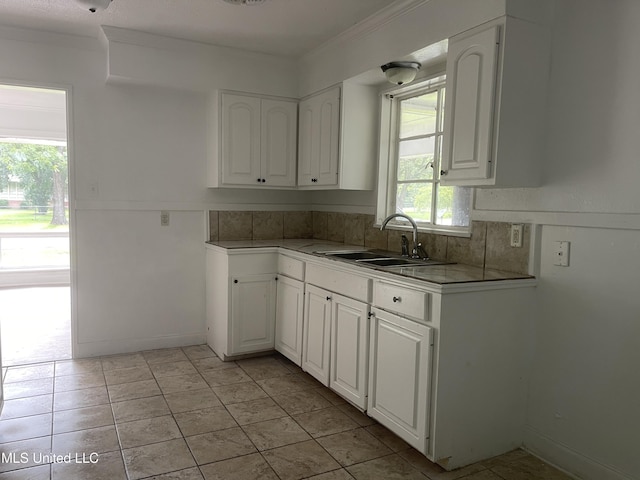 2938 Oak Forest Dr, Jackson, MS 39212 - kitchen featuring white cabinetry, light countertops, and crown molding