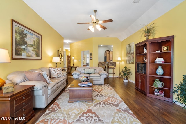 living room featuring ceiling fan and dark hardwood / wood-style flooring