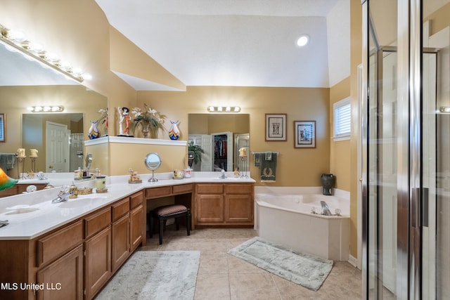 bathroom featuring vanity, tile patterned floors, lofted ceiling, and separate shower and tub