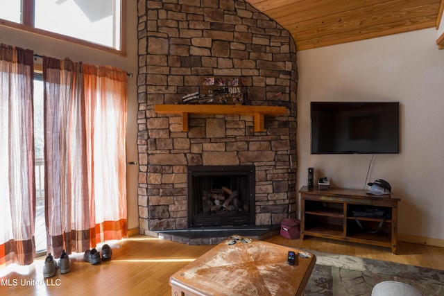 living room with wood-type flooring, vaulted ceiling, wooden ceiling, and a fireplace