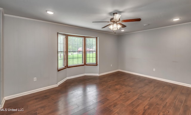 empty room with ornamental molding, ceiling fan, and dark hardwood / wood-style flooring