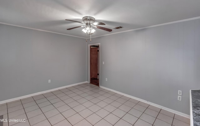 empty room featuring ornamental molding, light tile patterned floors, and ceiling fan