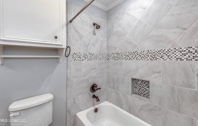 bathroom featuring crown molding, tiled shower / bath combo, and toilet