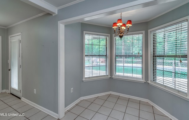 unfurnished dining area featuring crown molding, a healthy amount of sunlight, and a chandelier