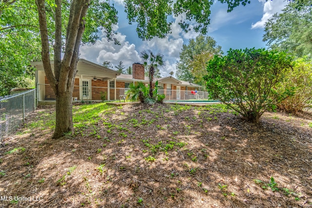 view of yard featuring a fenced in pool