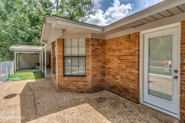 view of exterior entry featuring a patio