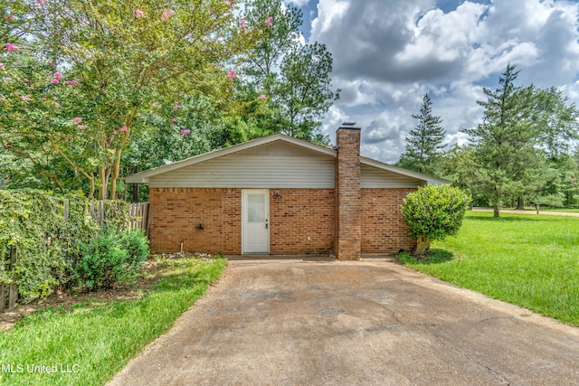 view of home's exterior with a yard