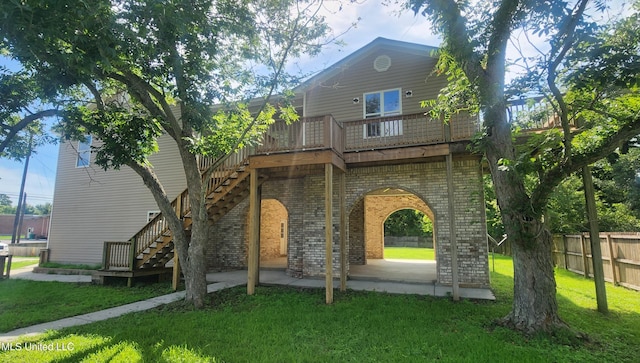 2708 Canty St, Pascagoula, MS 39567 - rear view of property featuring brick siding, stairs, a patio, and a deck