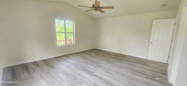 2708 Canty St, Pascagoula, MS 39567 - spare room with a ceiling fan, wood finished floors, vaulted ceiling, and a smoke detector