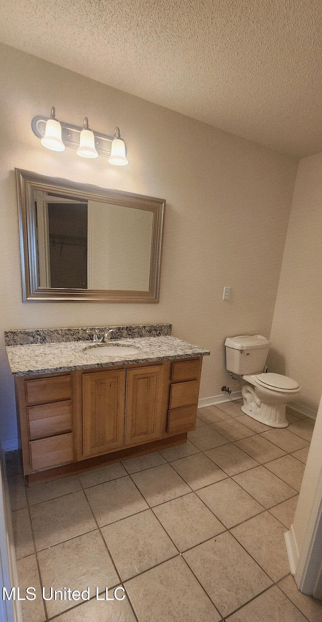 2708 Canty St, Pascagoula, MS 39567 - bathroom featuring vanity, tile patterned floors, and a textured ceiling