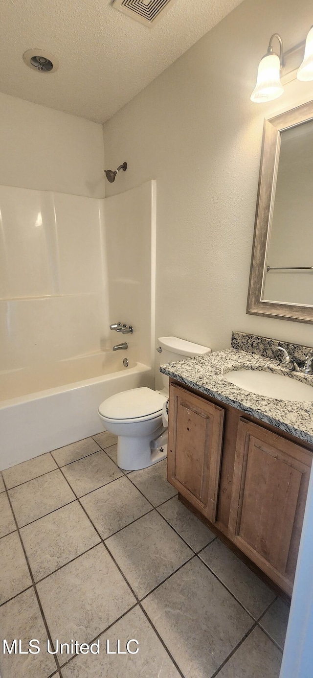2708 Canty St, Pascagoula, MS 39567 - full bath featuring vanity, a textured ceiling, washtub / shower combination, and tile patterned floors