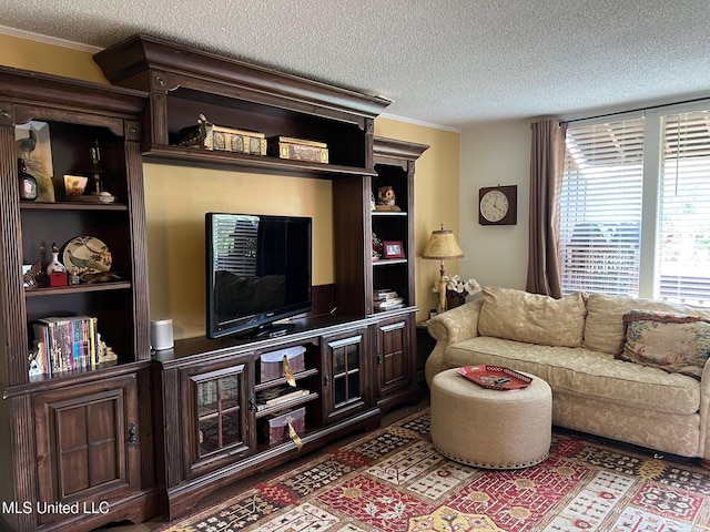 206 Lakeside Villa Unit A, Diamondhead, MS 39525 - living area with a textured ceiling and crown molding