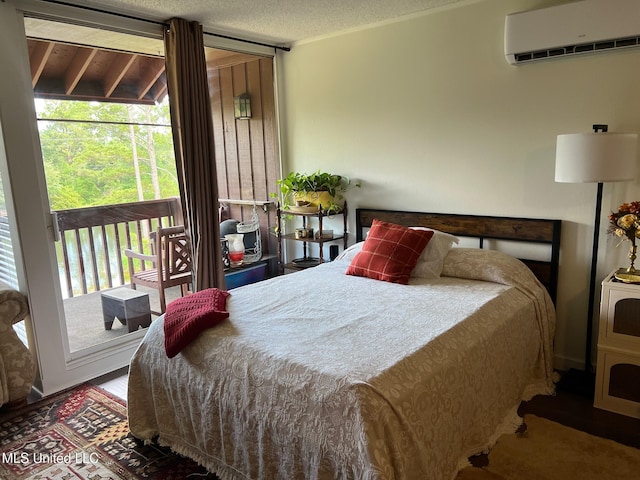 206 Lakeside Villa Unit A, Diamondhead, MS 39525 - bedroom with a wall mounted air conditioner and access to outside