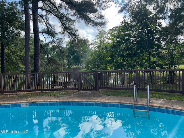 206 Lakeside Villa Unit A, Diamondhead, MS 39525 - view of swimming pool with a fenced backyard