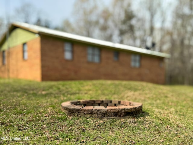 1172 Little Creek Dr, Oakland, MS 38948 - exterior space with a fire pit and a front lawn