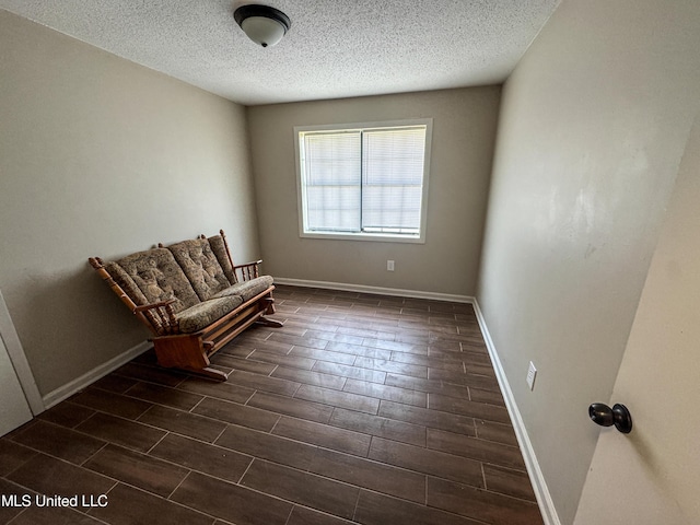 1172 Little Creek Dr, Oakland, MS 38948 - unfurnished room featuring wood finish floors, baseboards, and a textured ceiling