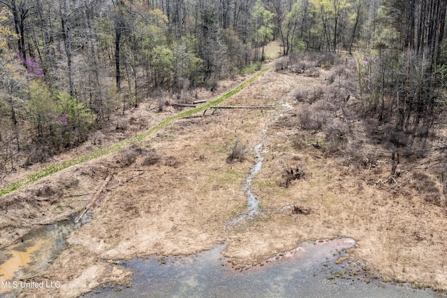 1172 Little Creek Dr, Oakland, MS 38948 - drone / aerial view featuring a wooded view