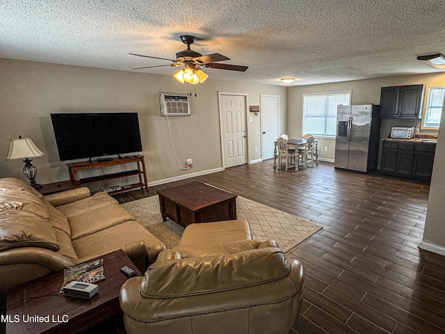 1172 Little Creek Dr, Oakland, MS 38948 - living area featuring dark wood-style flooring, a wealth of natural light, a wall unit AC, and ceiling fan