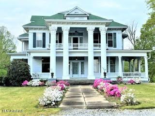 5 Spruce St, Oakland, MS 38948 - neoclassical / greek revival house featuring a porch, a front lawn, and a balcony