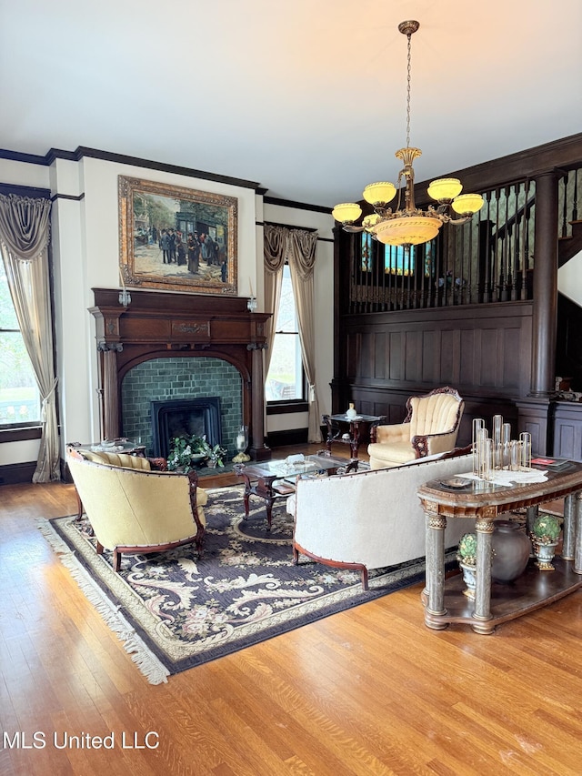 5 Spruce St, Oakland, MS 38948 - sitting room featuring wood finished floors, a tiled fireplace, and ornamental molding