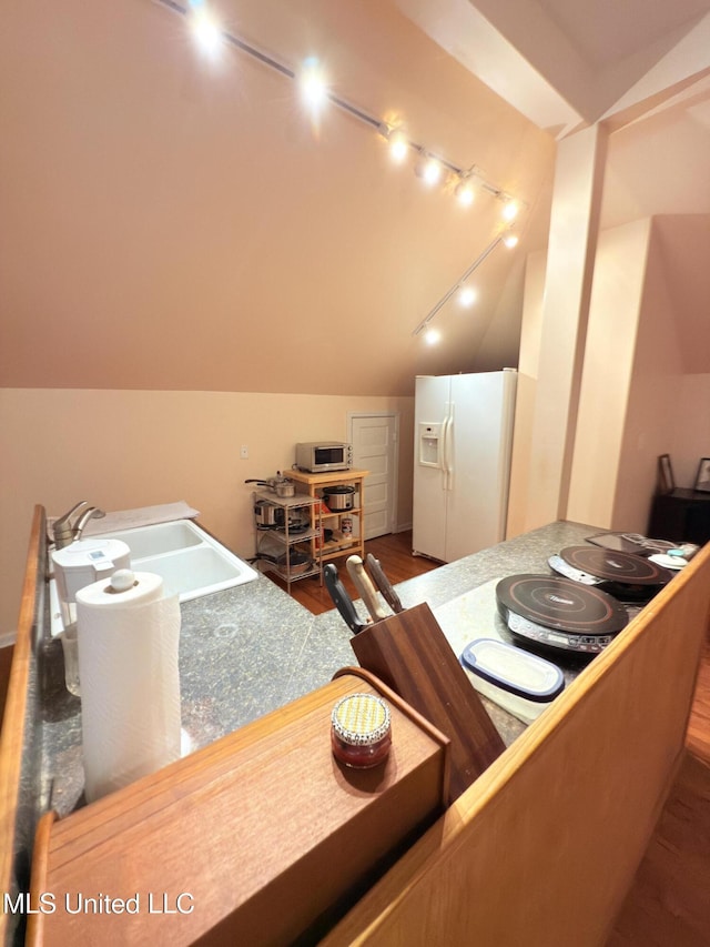 5 Spruce St, Oakland, MS 38948 - interior space featuring a sink, wood finished floors, and vaulted ceiling