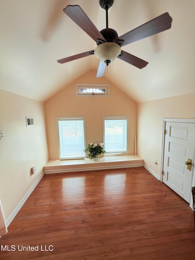 5 Spruce St, Oakland, MS 38948 - additional living space with lofted ceiling, plenty of natural light, wood finished floors, and visible vents