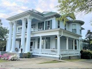 5 Spruce St, Oakland, MS 38948 - neoclassical home featuring a balcony and a porch