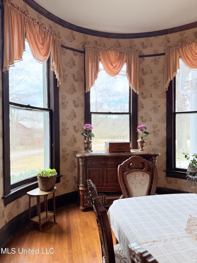 5 Spruce St, Oakland, MS 38948 - dining area featuring wallpapered walls, light wood-type flooring, and baseboards