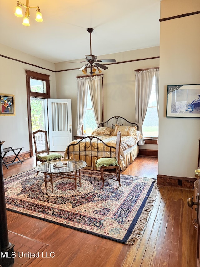 5 Spruce St, Oakland, MS 38948 - bedroom featuring hardwood / wood-style floors, multiple windows, and baseboards