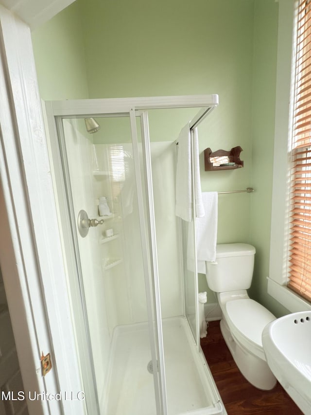 5 Spruce St, Oakland, MS 38948 - full bathroom featuring toilet, wood finished floors, and a shower stall