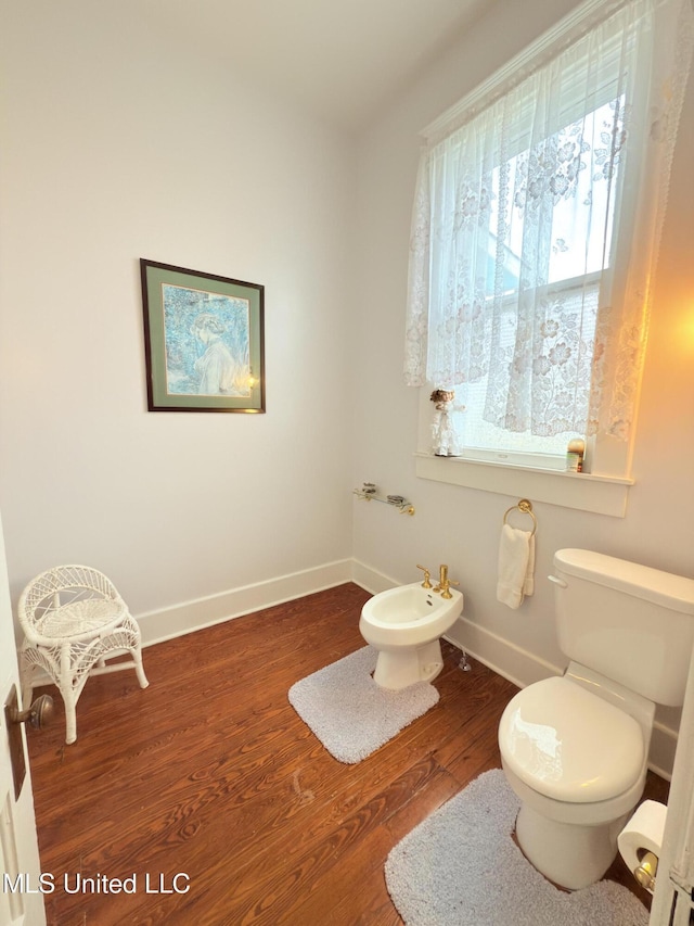 5 Spruce St, Oakland, MS 38948 - bathroom featuring baseboards, toilet, wood finished floors, and a bidet