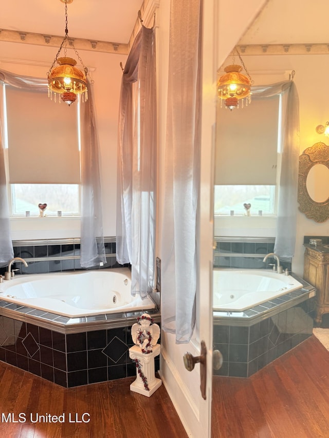 5 Spruce St, Oakland, MS 38948 - bathroom with a jetted tub and wood finished floors