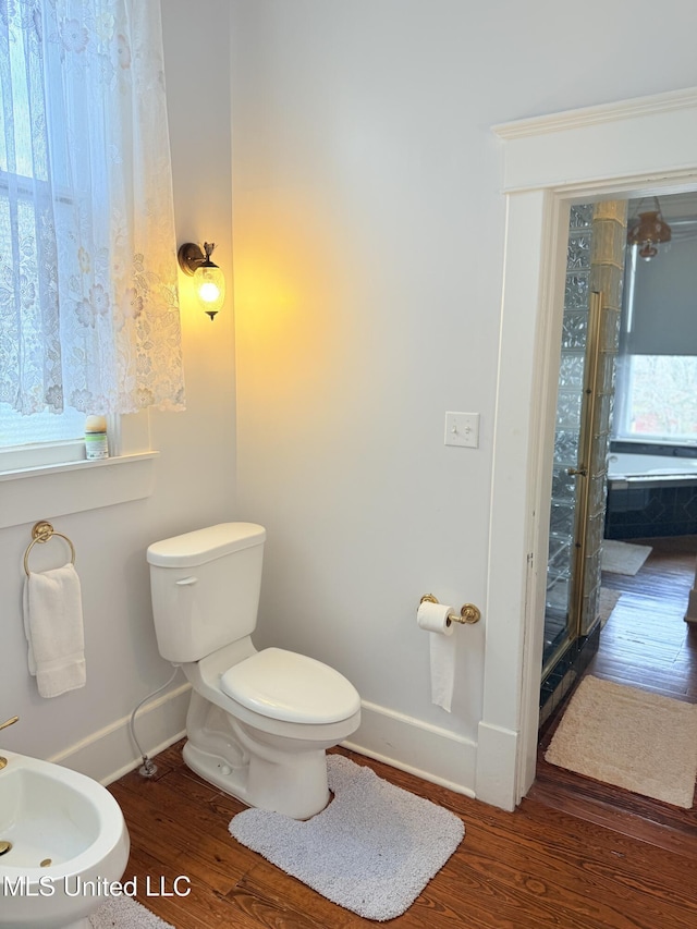 5 Spruce St, Oakland, MS 38948 - full bath featuring toilet, a stall shower, wood finished floors, a bidet, and baseboards