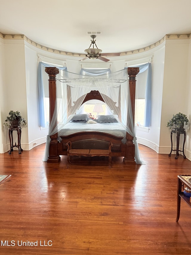 5 Spruce St, Oakland, MS 38948 - bedroom with visible vents, baseboards, and wood finished floors