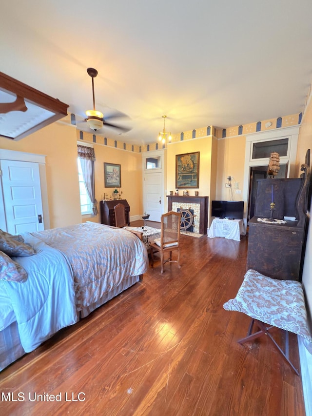 5 Spruce St, Oakland, MS 38948 - bedroom with a fireplace and wood finished floors