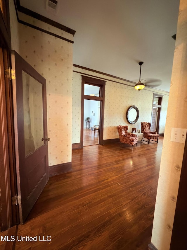 5 Spruce St, Oakland, MS 38948 - interior space with wood finished floors, visible vents, baseboards, wallpapered walls, and crown molding