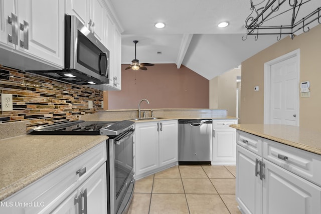 kitchen featuring white cabinetry, appliances with stainless steel finishes, sink, and light tile patterned floors