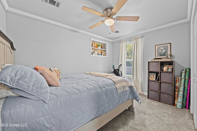 carpeted bedroom featuring ornamental molding and ceiling fan