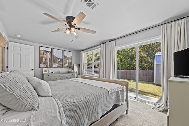 carpeted bedroom featuring access to exterior and ceiling fan