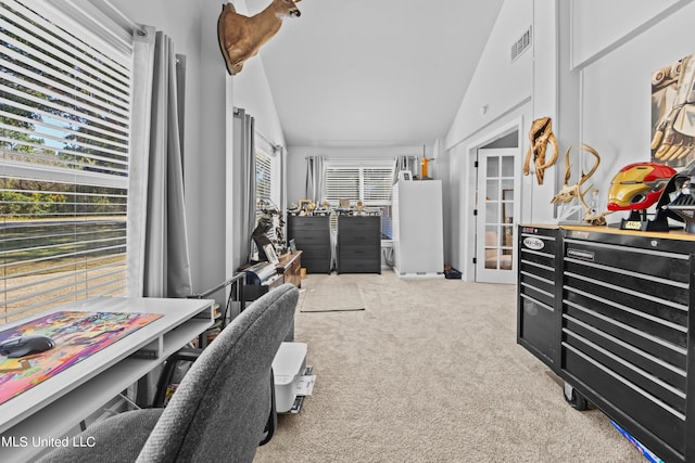 carpeted office space with lofted ceiling