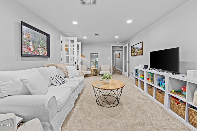 living room with light colored carpet